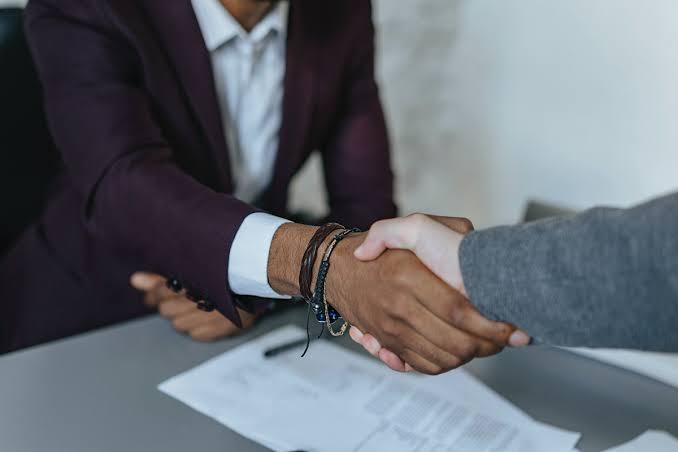 Professional handshake over a real estate contract